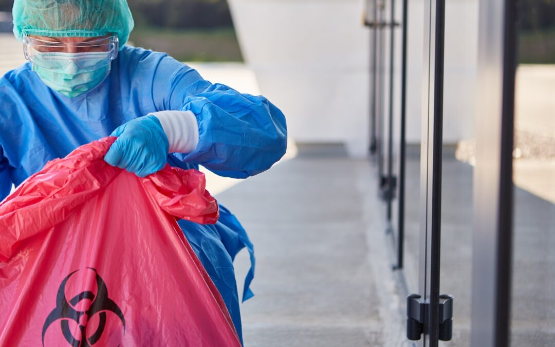 Biohazard team member with a bag